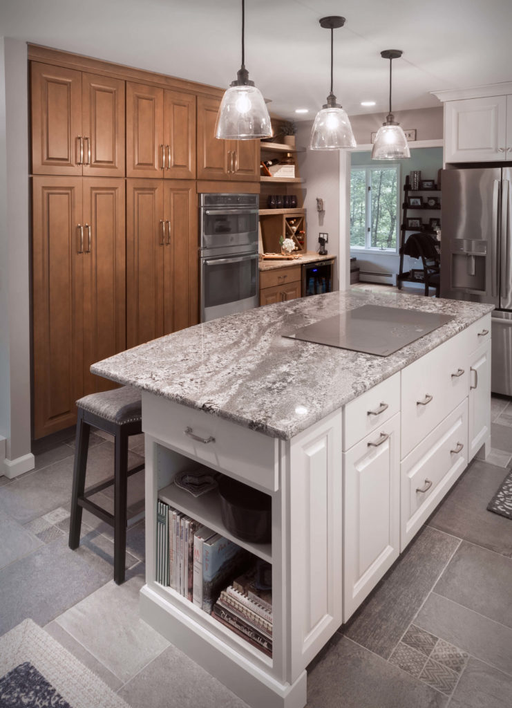 Burlington kitchen remodel island with end cap and flush stove top, full height cabinets with rollouts, and beverage nook.