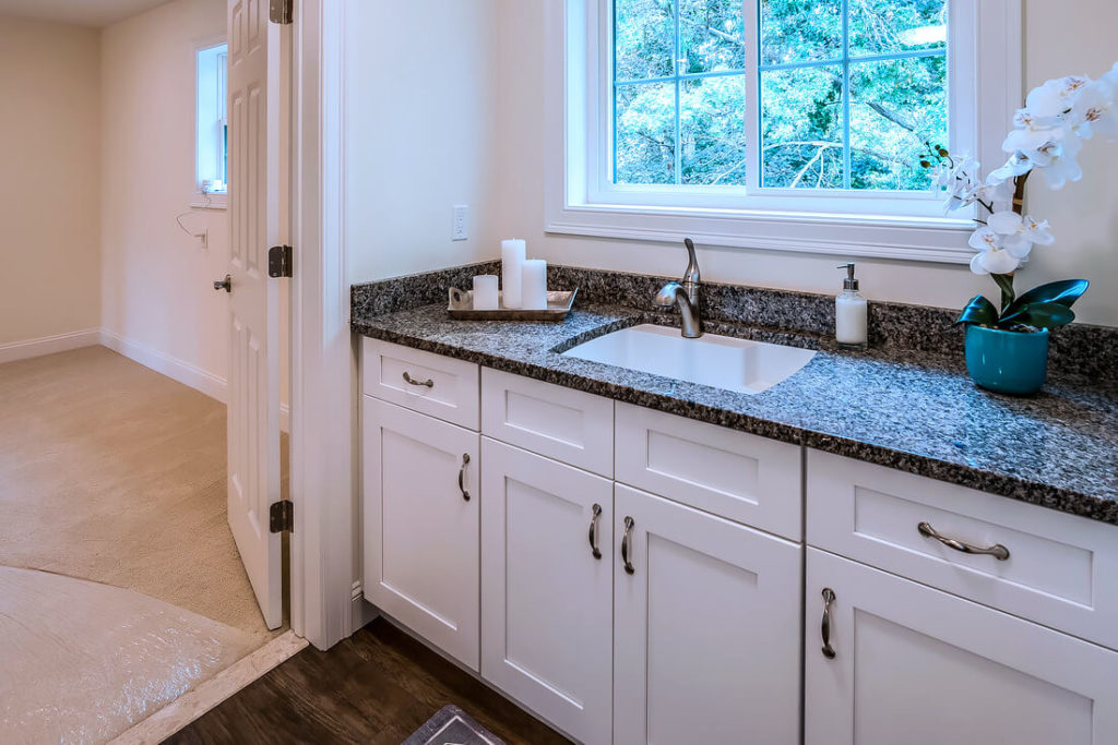 Detail view of basement sink cabinets installed by Viking Kitchens at Gledhill Estates.