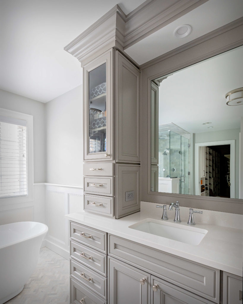Higganum bathroom remodel showing custom cut mirrors and glass cabinets.
