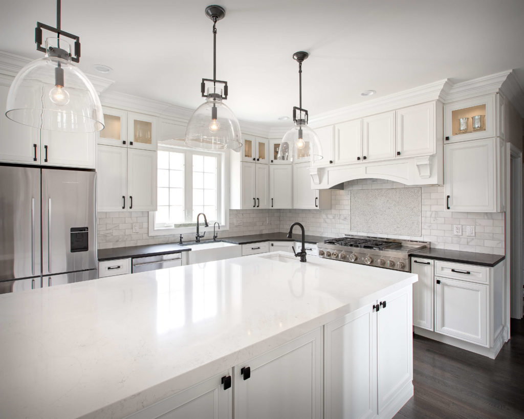 Farmhouse modern kitchen remodel with kitchen cabinets, countertops, and island installed by Viking Kitchens.