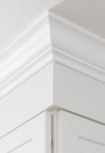 Detail of the upper cabinets, showing custom crown moulding.