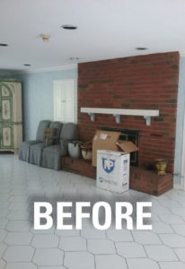 View of the island area and fireplace area BEFORE work on this kitchen remodel in West Hartford.