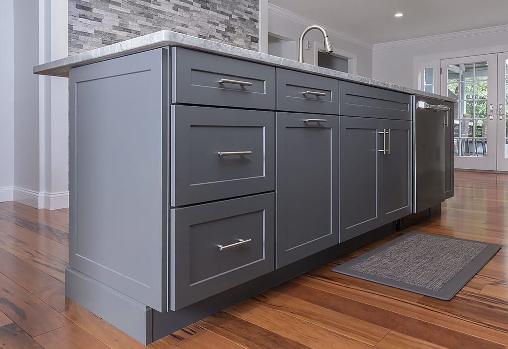 Detail of the Homecrest island cabinets in Sedona door style with matching drawer front in Galaxy Opaque.